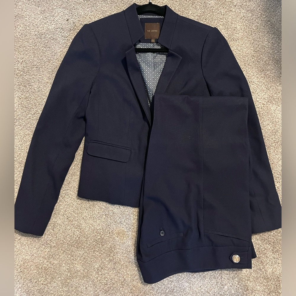 Navy textured suit with gold detail buttons